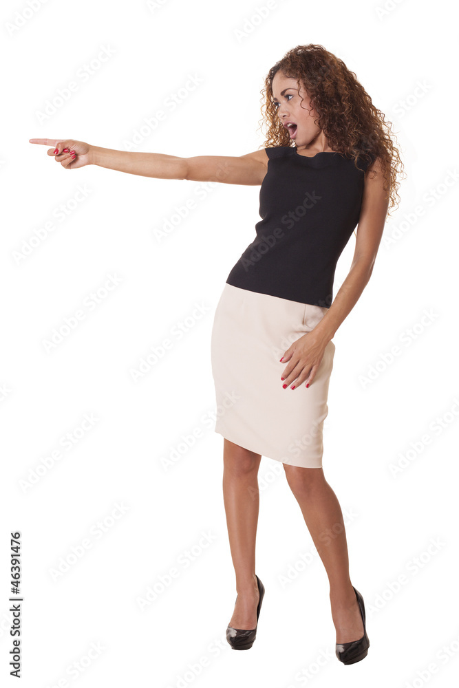 Pretty woman points to something with a look of surprise. Pretty woman points to something with a look of surprise.