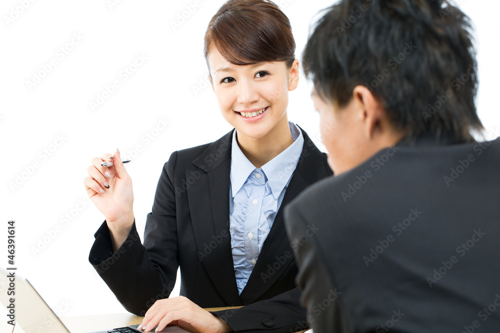 Young asian smiling businesswoman and businessman Young asian smiling businesswoman and businessman