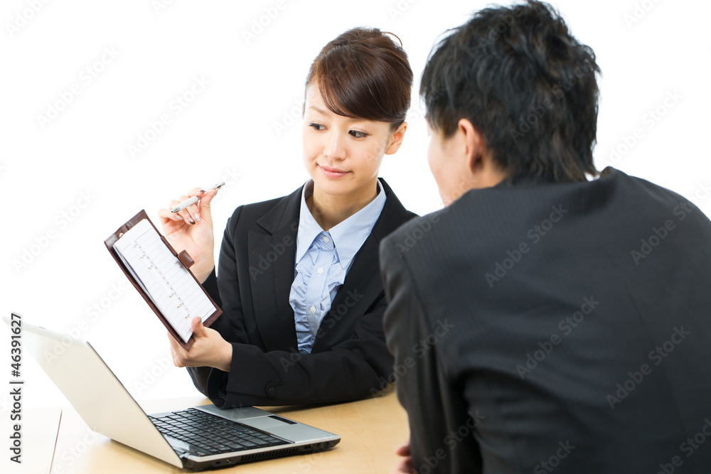 Young asian smiling businesswoman and businessman Young asian smiling businesswoman and businessman