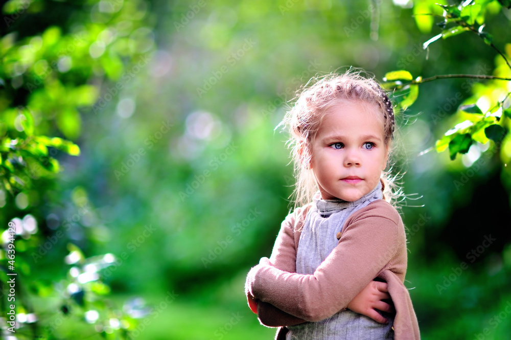 preschooler girl in casual clothes at green nature park backgrou preschooler girl in casual clothes at green nature park backgrou