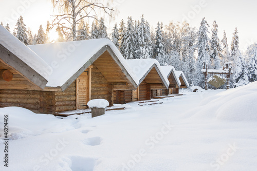 Small camping houses at snowy winter day