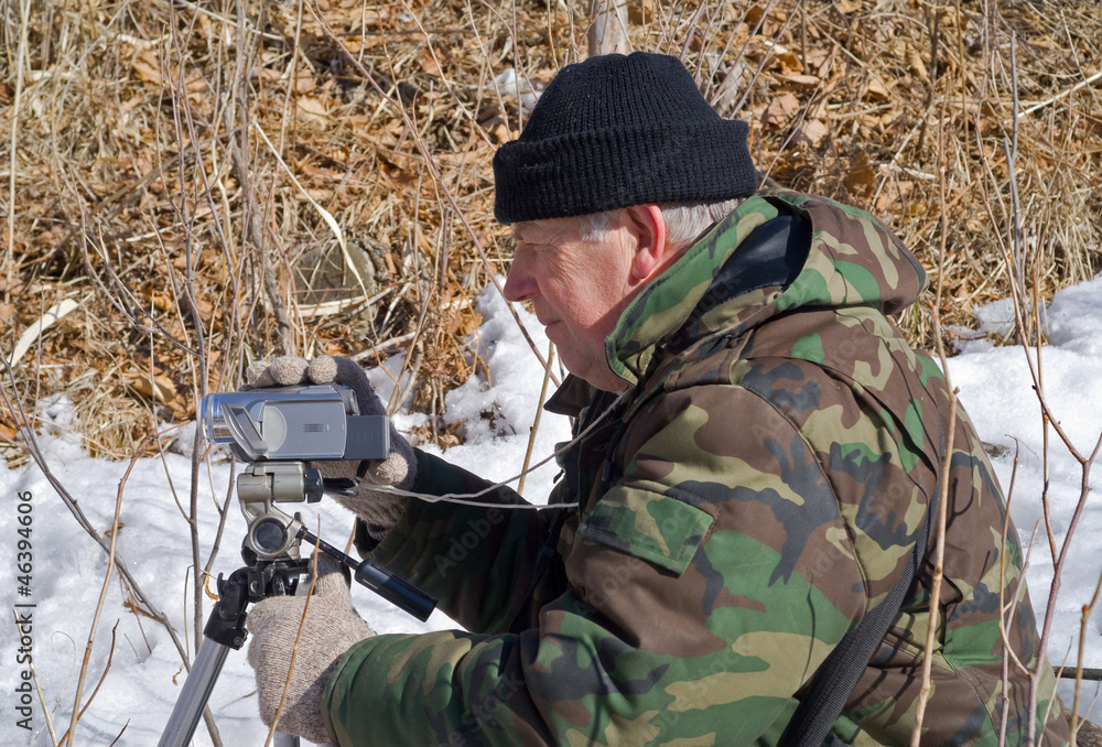 Naklejka premium Man with camera 16