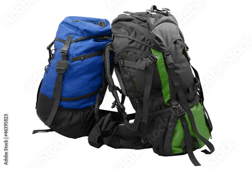 Two used tourist backpacks isolated on white