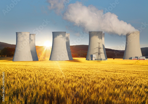 Nuclear power plant with yellow field and sun © TTstudio