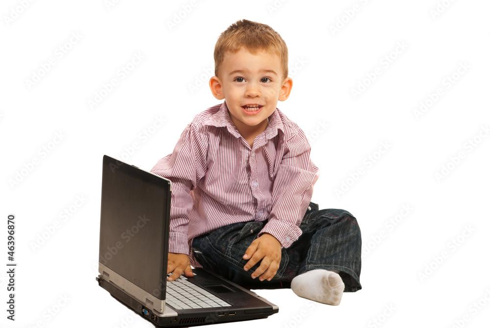 Smiling little boy with laptop Smiling little boy with laptop