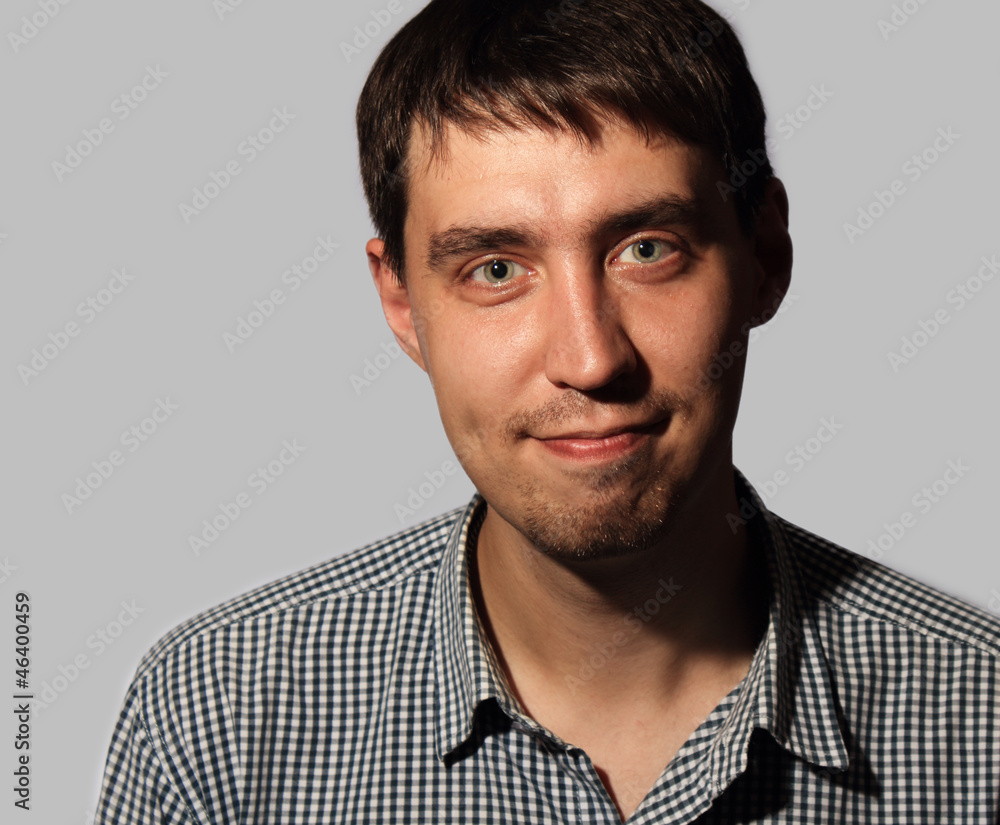 Fototapeta premium Funny smiling young man