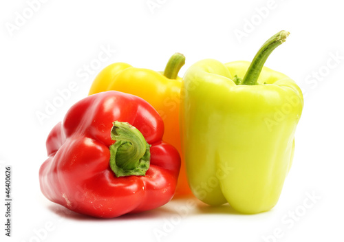 fresh yellow, red and green bell peppers isolated on white