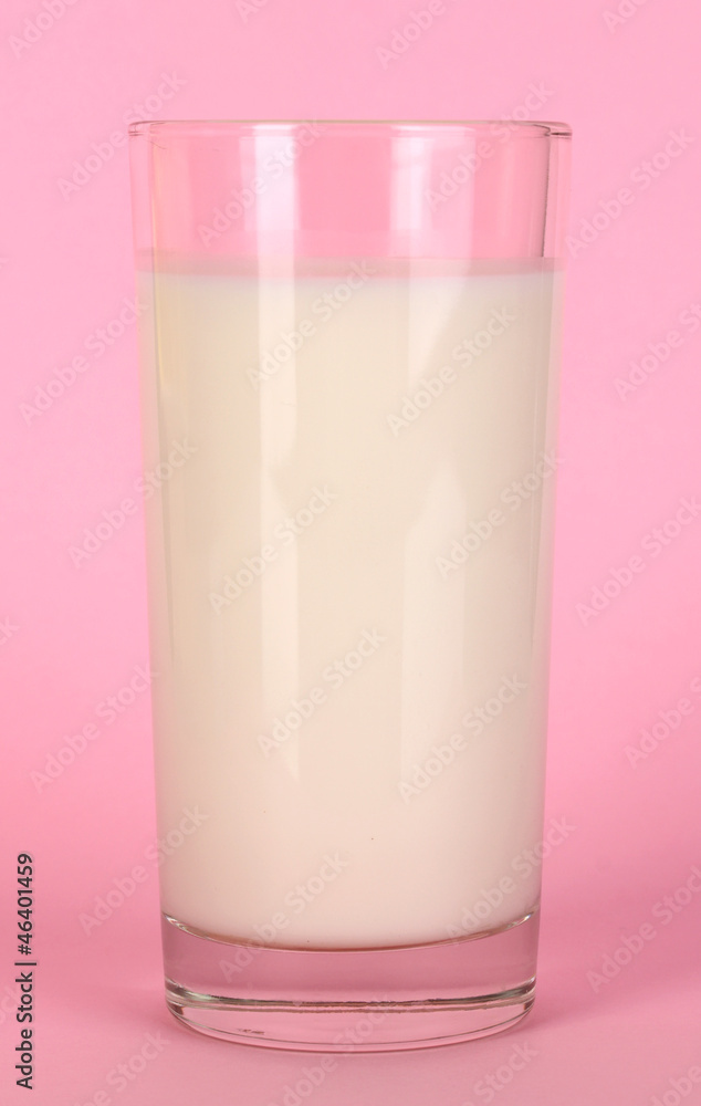 Glass of fresh new milk on pink background Glass of fresh new milk on pink background