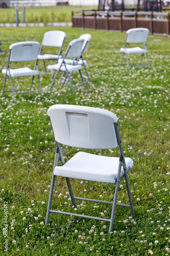 chairs on green grass.