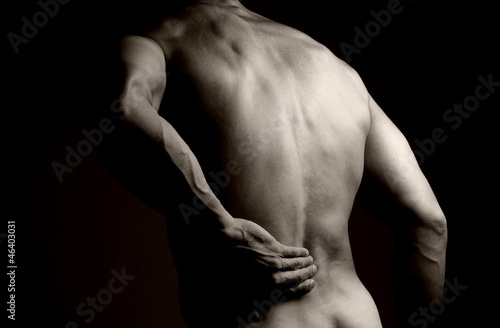 Muscular Man with Backache