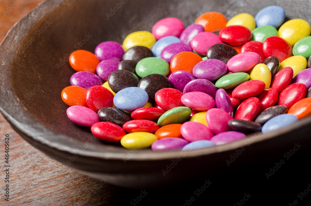 A bowl of candy coated chocolates. A bowl of candy coated chocolates.