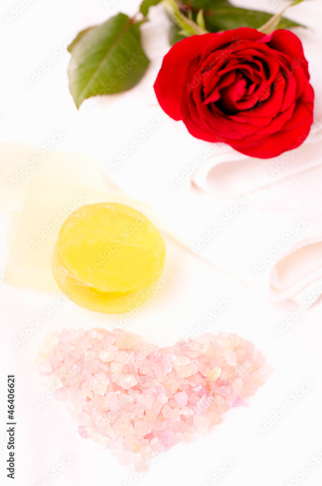 Heart shape pink bath salt close up with romantic spa concept Heart shape pink bath salt close up with romantic spa concept