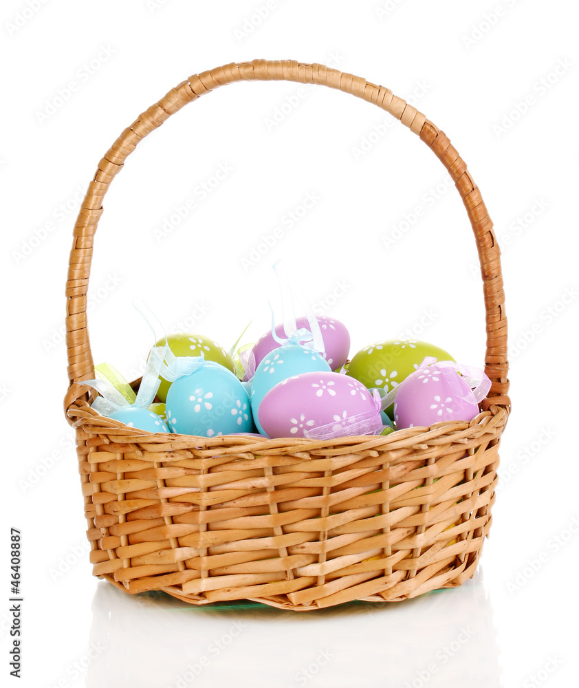 Colorful easter eggs in basket isolated on white Colorful easter eggs in basket isolated on white