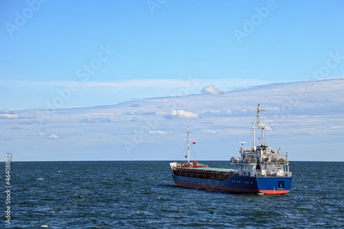 Lone cargo ship at sea
