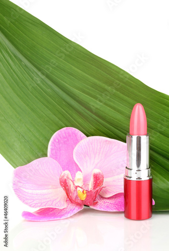 lipstick on green leaf isolated on white