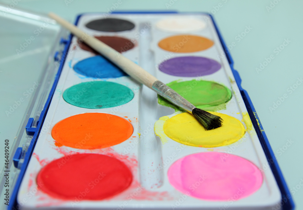 Naklejka premium set of water-colour paints and brush