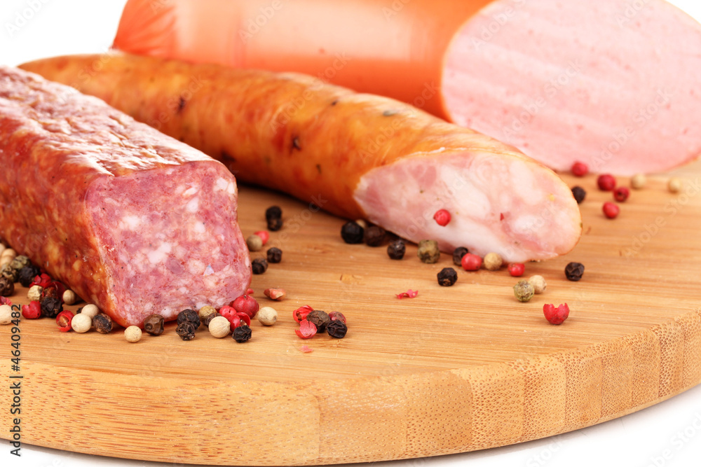 Tasty sausage on chopping board close-up Tasty sausage on chopping board close-up