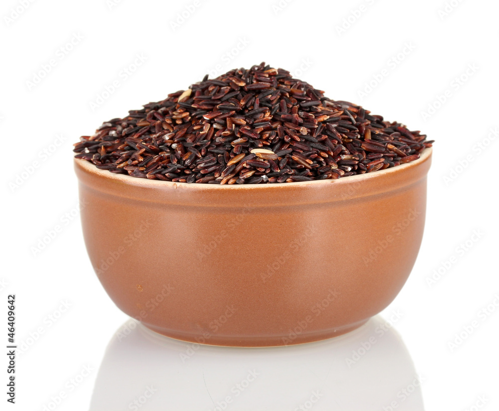 black rice in a brown plate , isolated on white black rice in a brown plate , isolated on white
