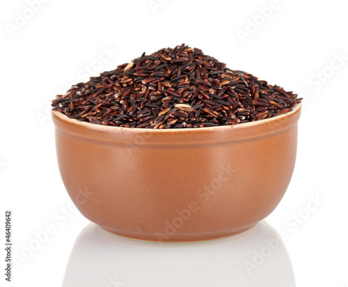 black rice in a brown plate , isolated on white