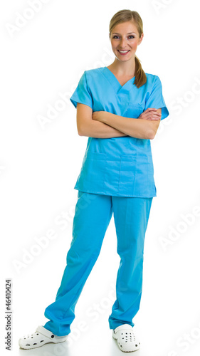 Woman in medical doctor suit isolated on white