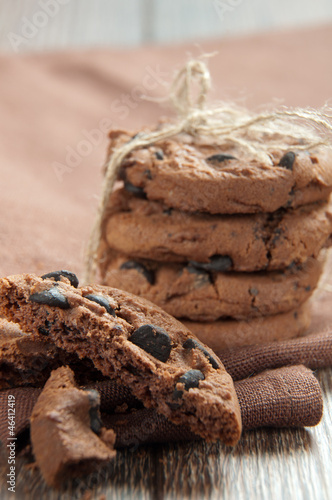 Pile of delicious chocolate chip cookies on table
