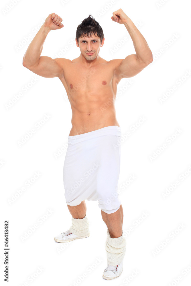 Muscular sexy naked dancer posing in the studio Muscular sexy naked dancer posing in the studio
