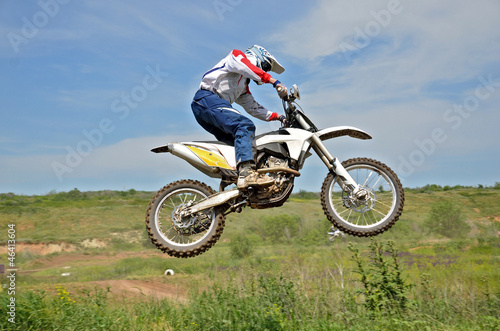Motocross rider on a motorcycle in the air
