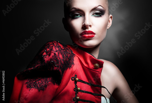 Obraz na plátně gorgeous sexy woman in red jacket with red lips