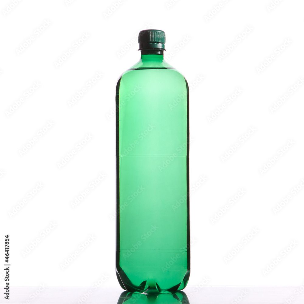 Green plastic bottle with a drink isolated on white Green plastic bottle with a drink isolated on white
