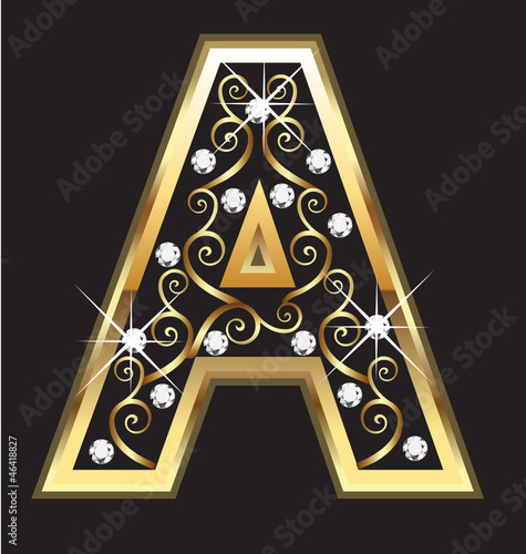 A gold letter with swirly ornaments