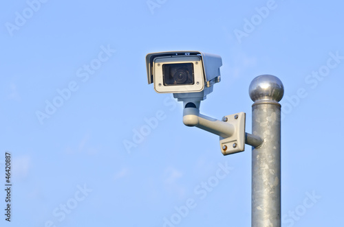 Security camera on blue sky