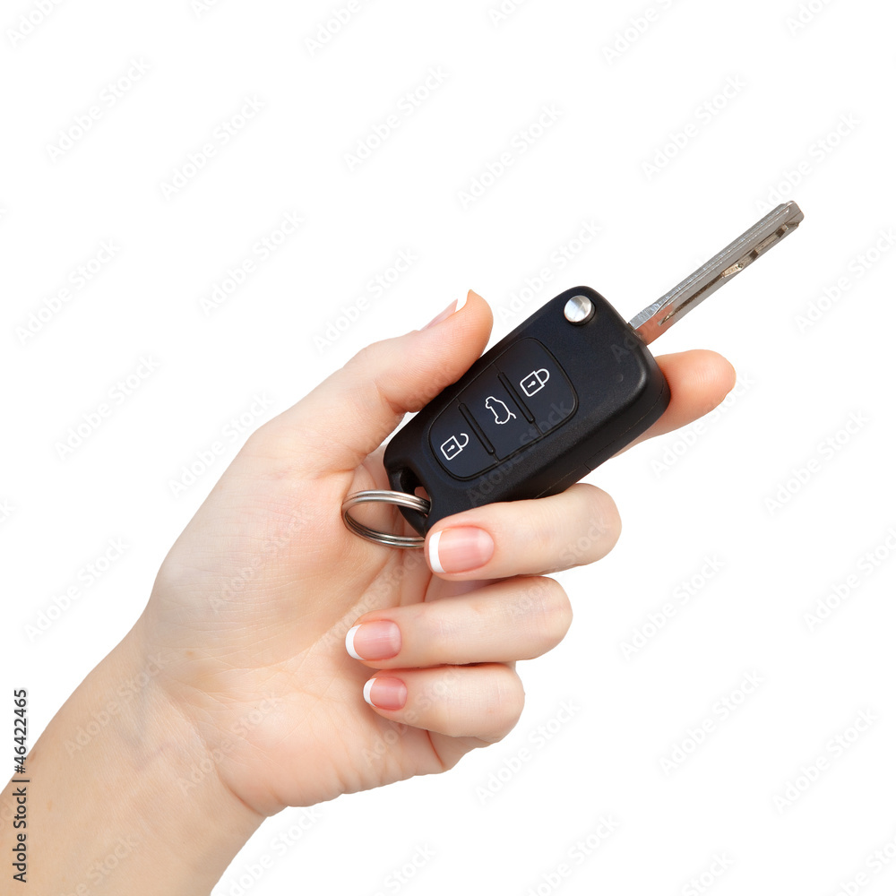 woman hand on isolated background holding car key woman hand on isolated background holding car key