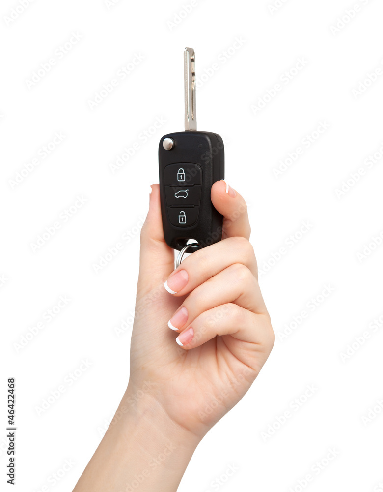 woman hand on isolated background holding car key woman hand on isolated background holding car key