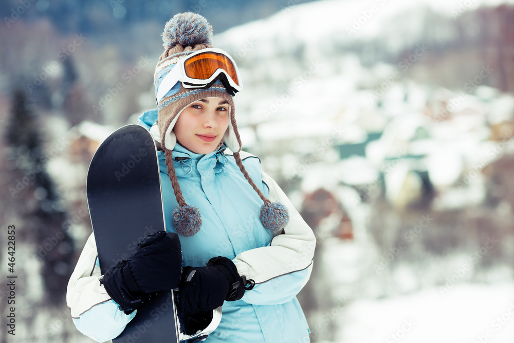 Girl holding snowboard