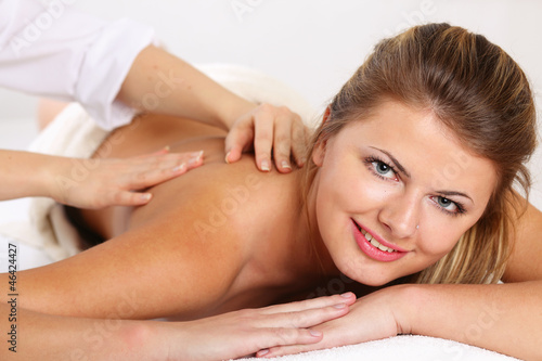 An attractive woman getting spa treatment, isolated on white