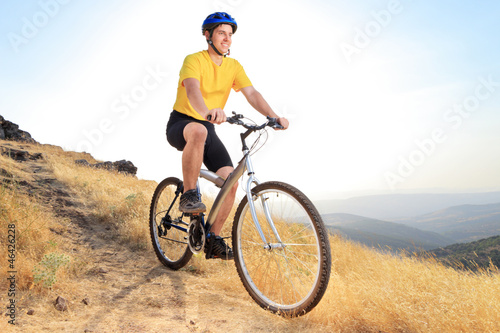 Biker riding a mountain bike on a sunset