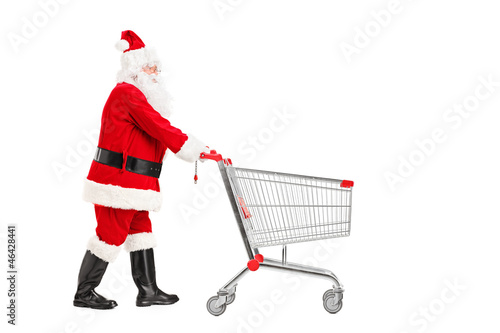Santa Claus pushing an empty shopping cart © Ljupco Smokovski
