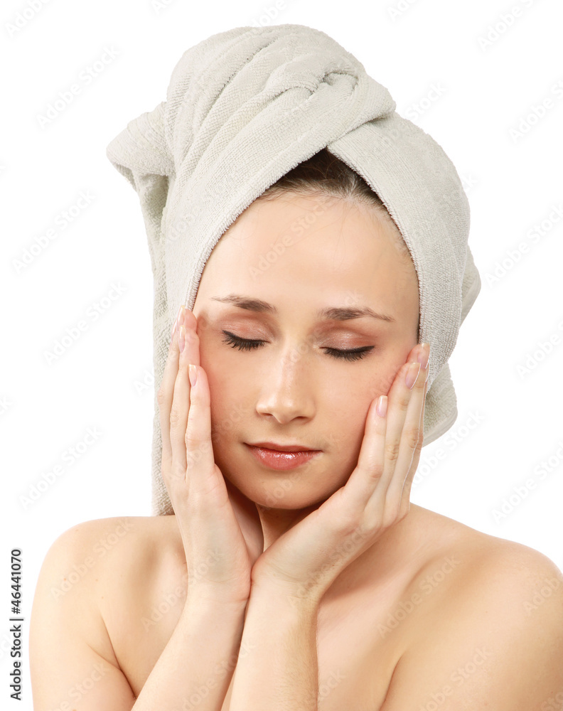 A beautiful young woman touching her face A beautiful young woman touching her face