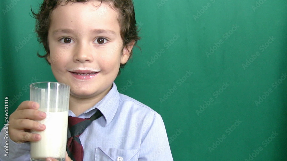 Little boy drinking milk on green screeen Little boy drinking milk on green screeen