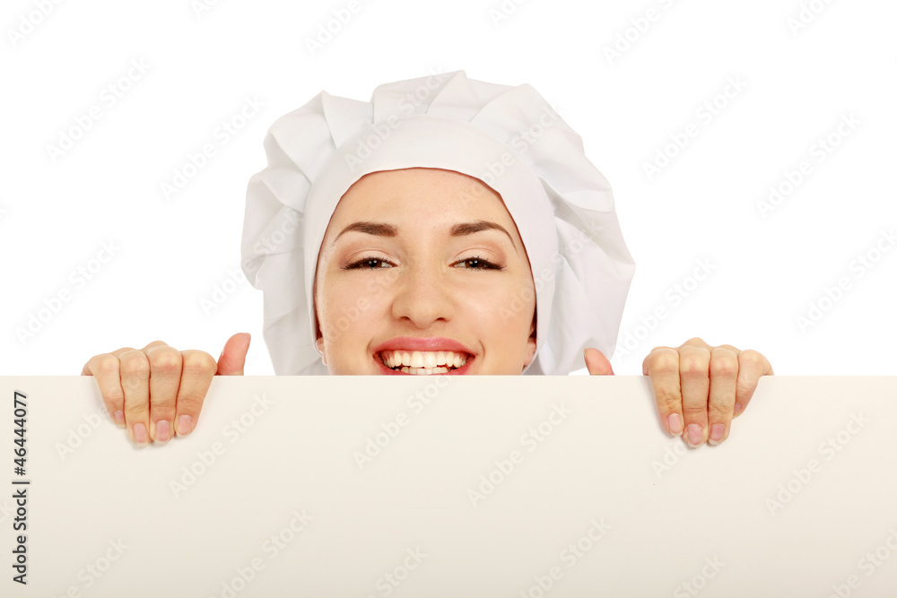 Happy woman cook or baker holding over paper sign billboard. Happy woman cook or baker holding over paper sign billboard.