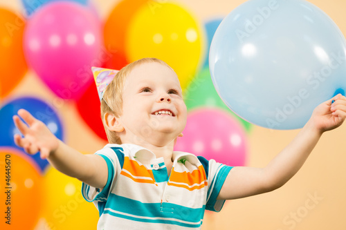 joyful kid boy with balloon...