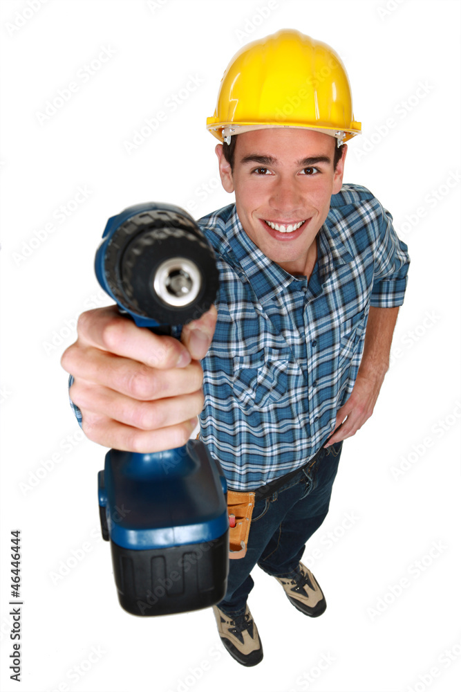 Tradesman holding a power tool Tradesman holding a power tool
