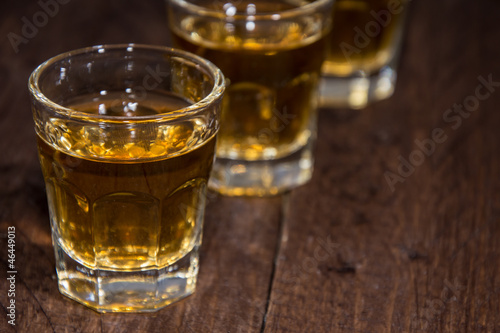 Line of Rum Shots on wooden background