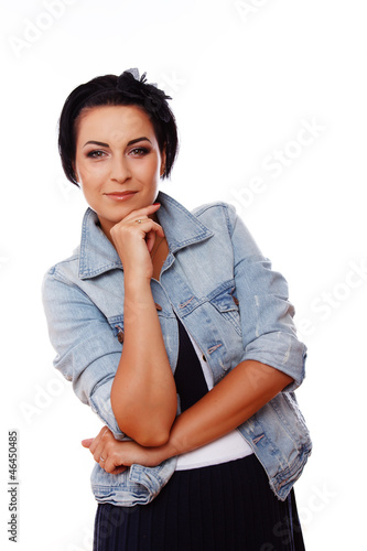 Portrait of beautiful woman posing on white background in jeans photo