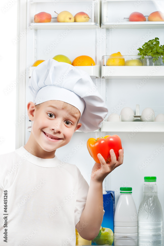 cute scullion is choosing food near the open refrigerator cute scullion is choosing food near the open refrigerator