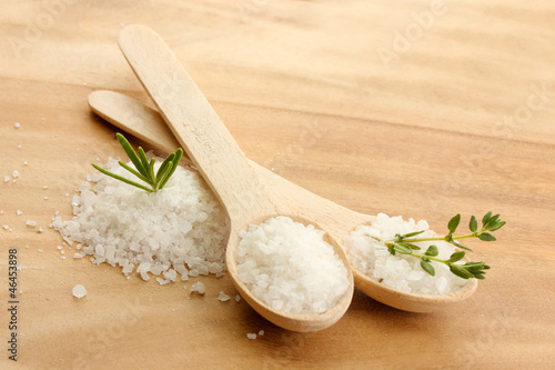salt in spoons with fresh  rosemary and thyme