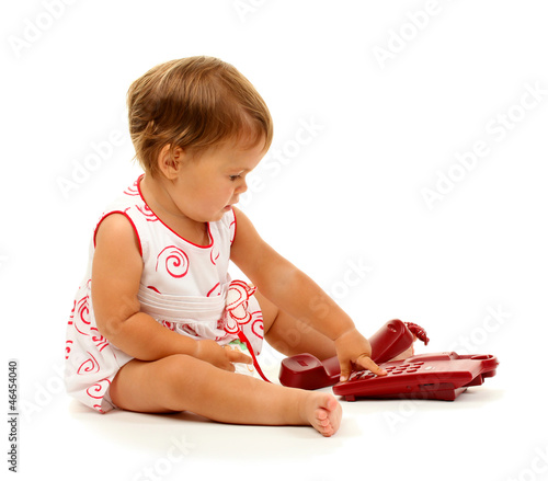 Cute baby with telephone is...