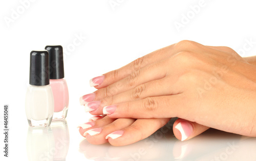 Beautiful woman s hands with jars of nail polish 
