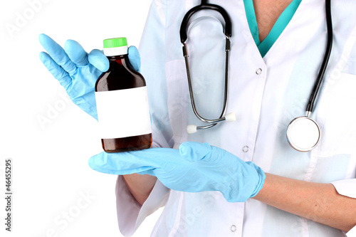 Doctor with bottle isolated on white photo