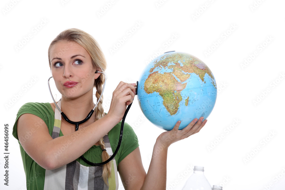 Woman auscultating globe